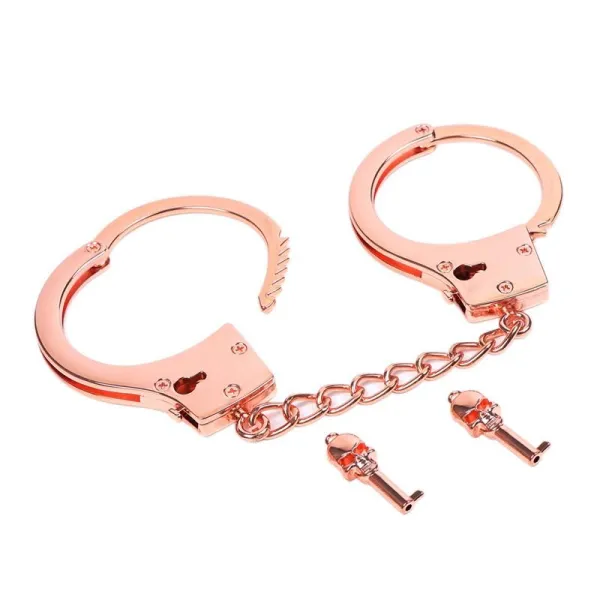 Roségoldene Handschellen mit Totenkopfschlüsseln von Latetobed BDSM Line | Fesselliebe.de