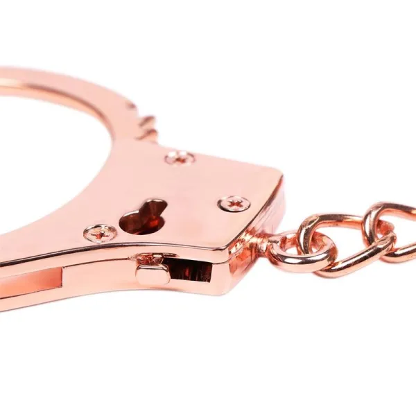 Roségoldene Handschellen mit Totenkopfschlüsseln von Latetobed BDSM Line | Fesselliebe.de